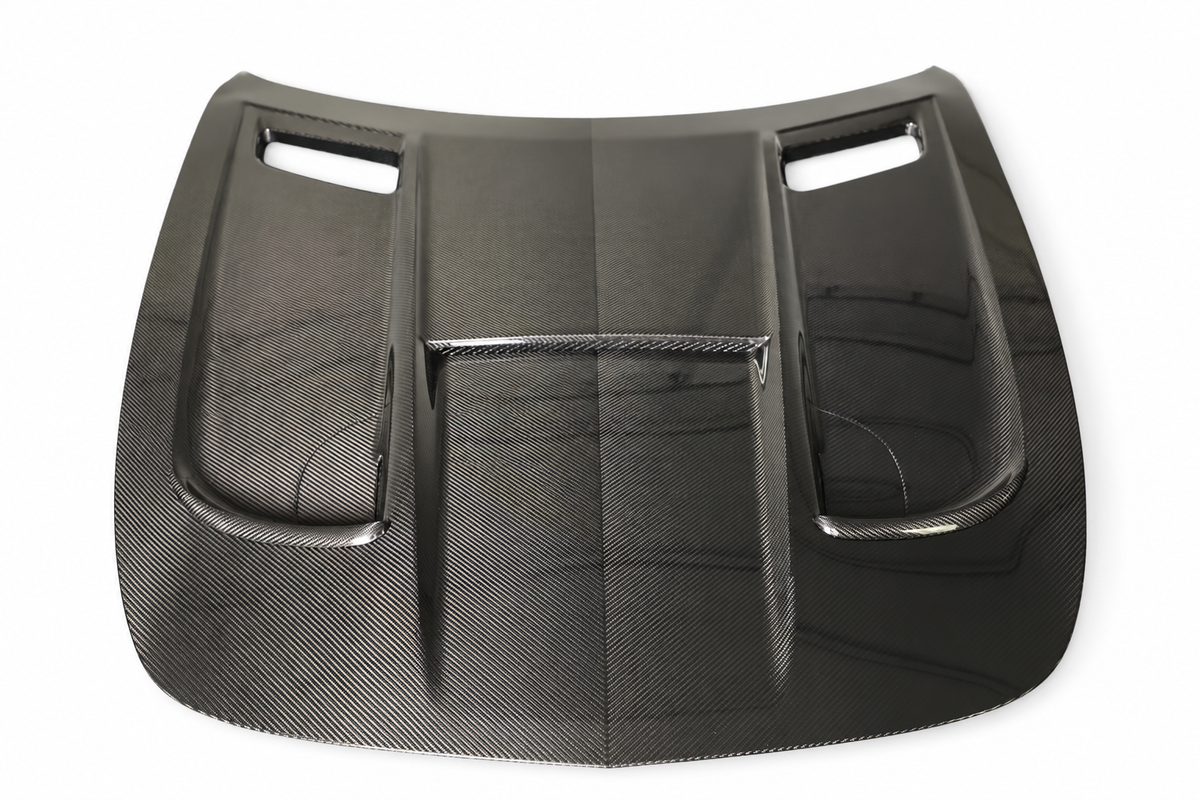 Black Series-style dry carbon bonnet for Mercedes-AMG GT and GT S C190, top view on a white studio background