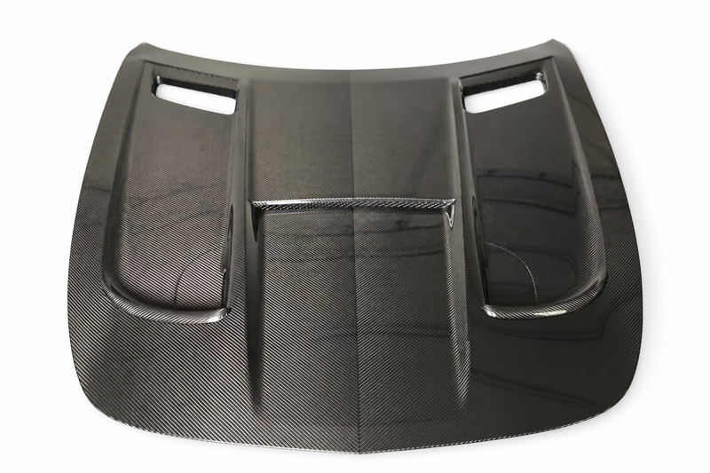 Black Series-style dry carbon bonnet for Mercedes-AMG GT and GT S C190, top view on a white studio background