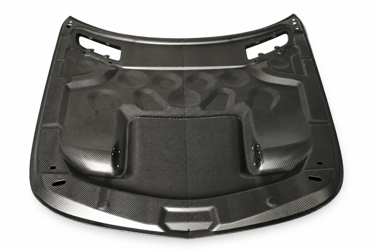 Underside of Black Series-style dry carbon bonnet for Mercedes-AMG GT C190 on a white studio background