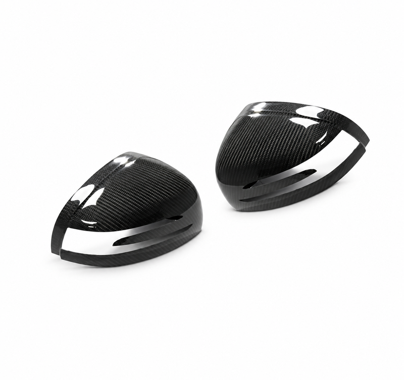Pair of gloss carbon fibre mirror covers for Mercedes-AMG GT and GT S C190 on a white studio background