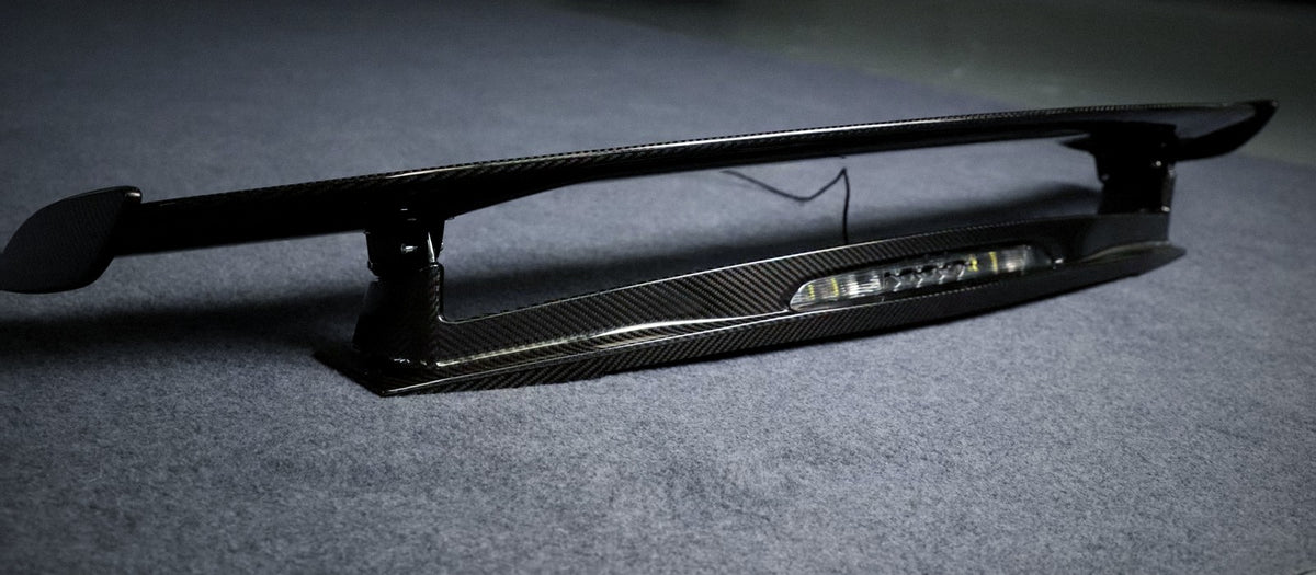 GT-R style carbon fibre rear spoiler, wing profile and mounting pedestal detail