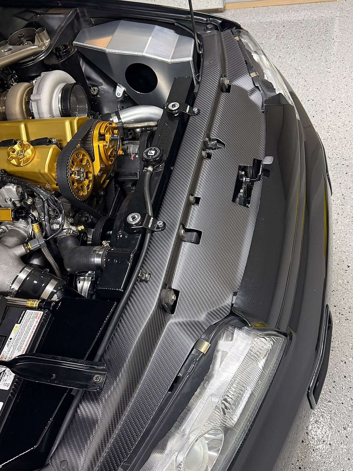 Carbonetics dry carbon cooling panel fitted across the radiator support of a customer Nissan Skyline R32 GT-R