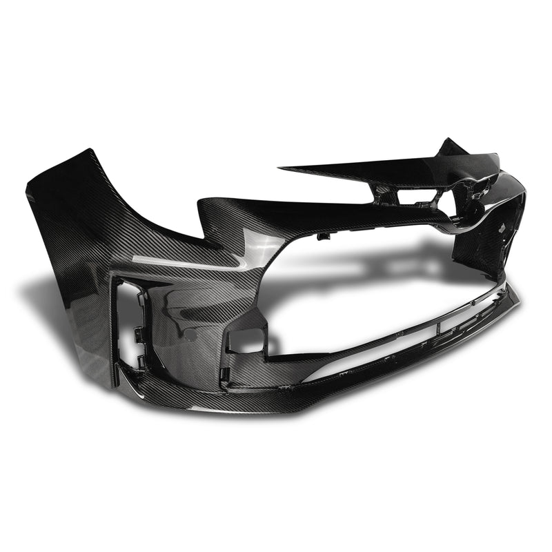 Toyota GR Corolla dry carbon fibre front bumper shell, angled view showing exposed carbon weave